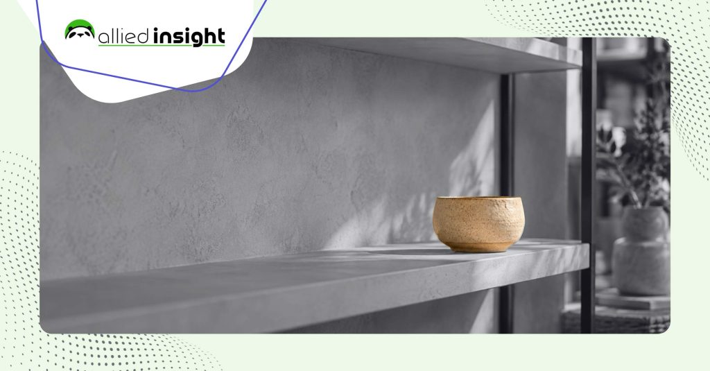 A single tan ceramic bowl sits alone on an empty gray concrete shelf. Allied Insight logo.